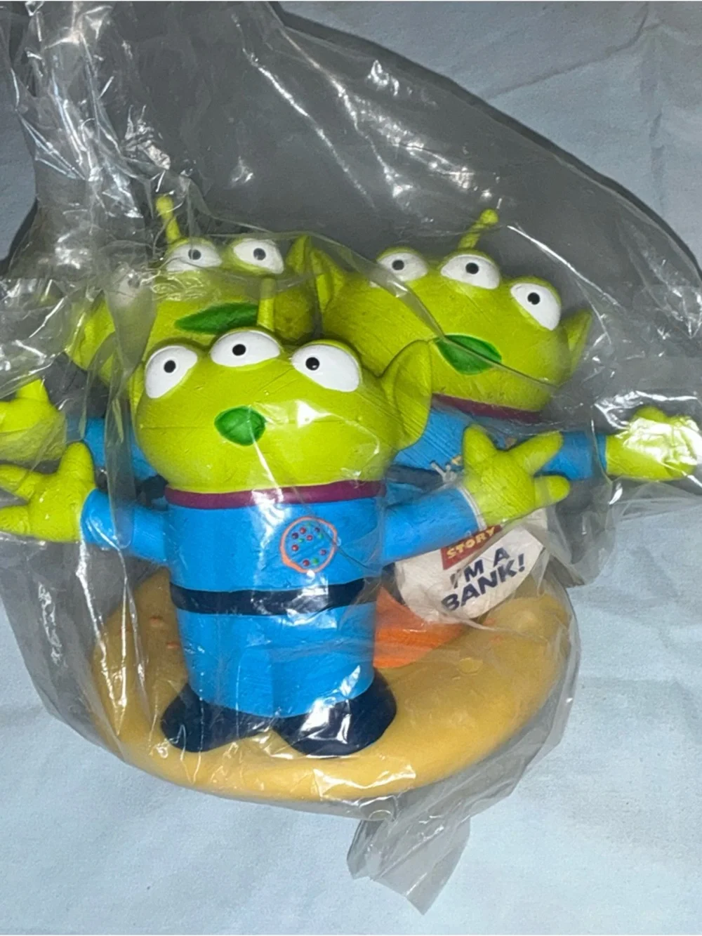 The Claw Green Alien Toy Coin Bank Blue Outfit Standing - Picture 1 of 16